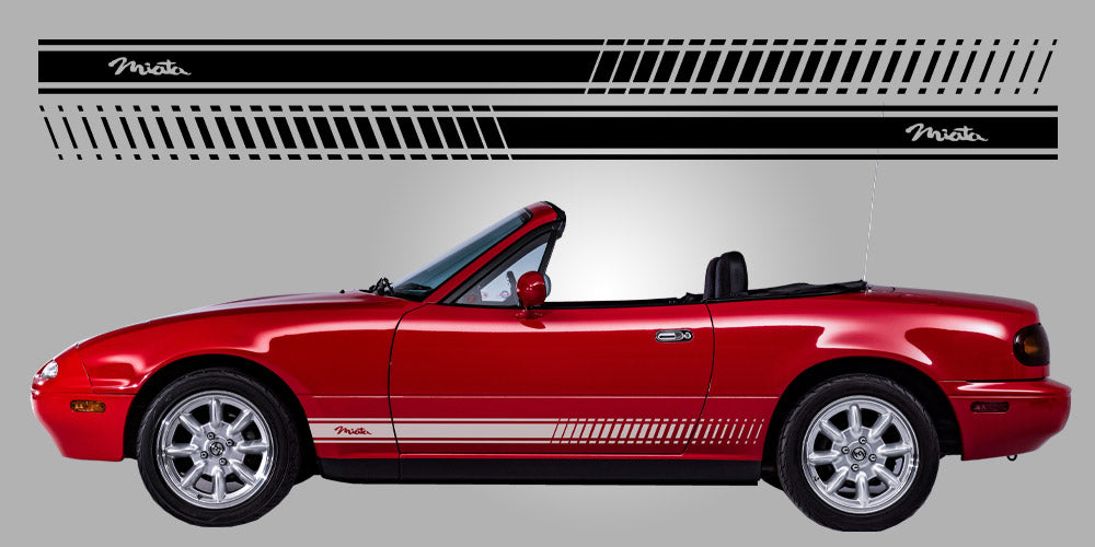 Red Miata car with 'Miata' side stripes on a gray background